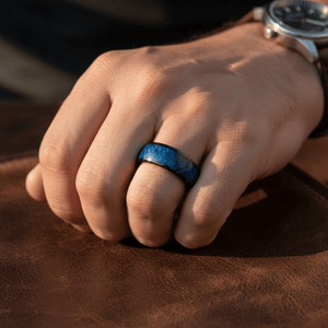 NASOS — Lifestyle photo on hand — men's tungsten wedding ring.
