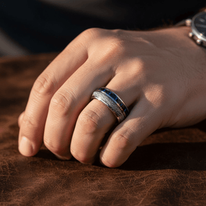 NEBULON — Lifestyle photo on hand — men's tungsten wedding ring.