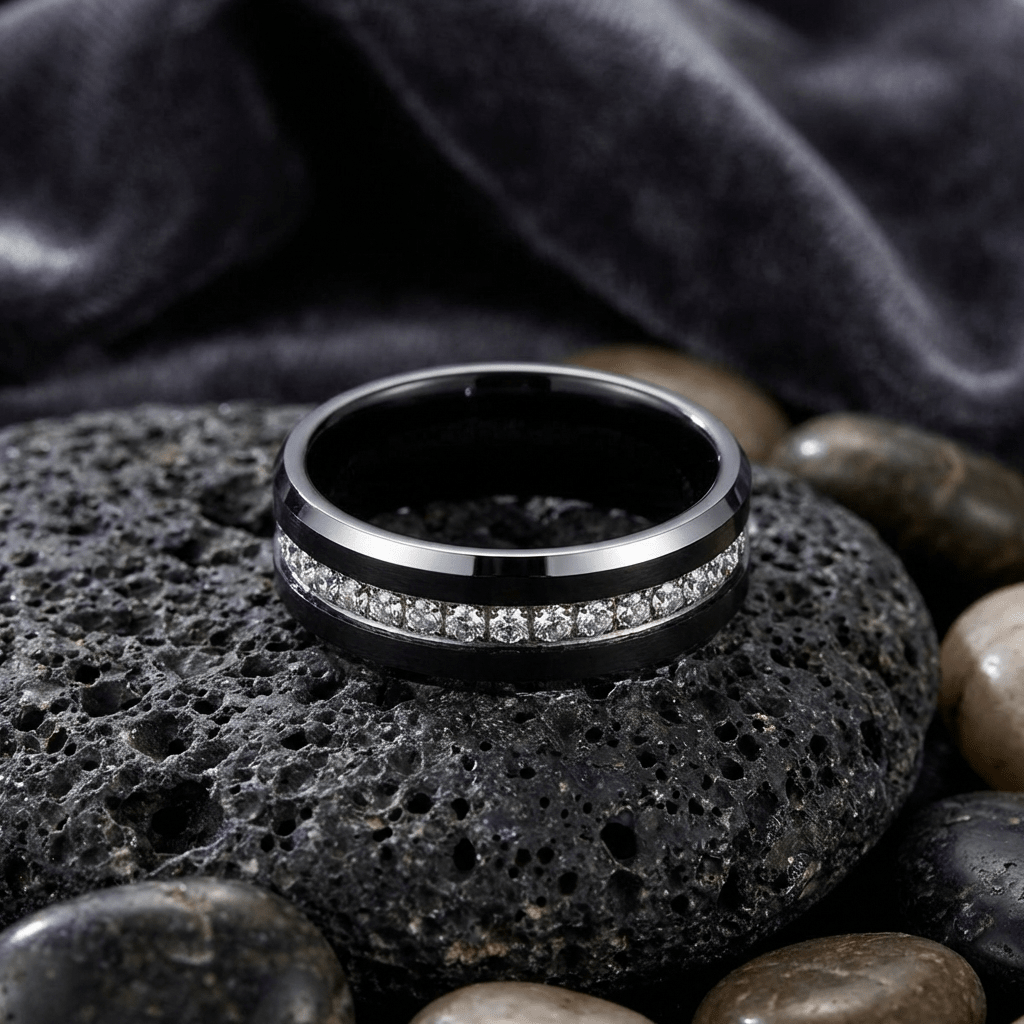 Top-down view of NEMESIS black tungsten ring with white CZ stones channel-set around the band