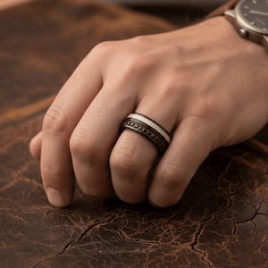 NIGHTMERE — Lifestyle photo on hand — men's tungsten wedding ring.