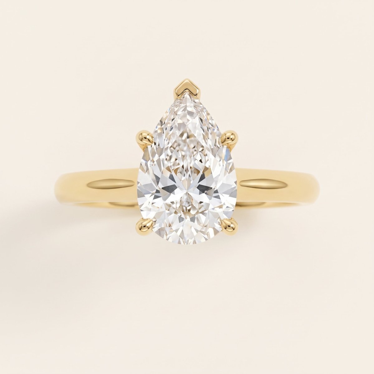 Pear lab-grown diamond solitaire engagement ring, Yellow Gold, face-on detail macro