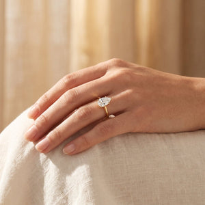 Pear lab-grown diamond solitaire engagement ring, Yellow Gold, lifestyle photograph