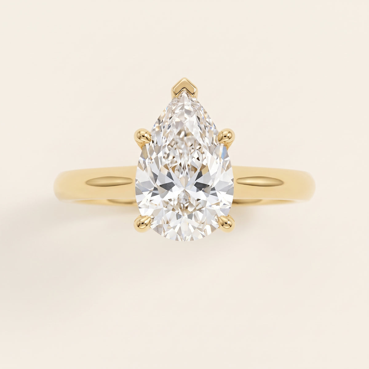 Pear lab-grown diamond solitaire engagement ring, Yellow Gold, face-on detail macro