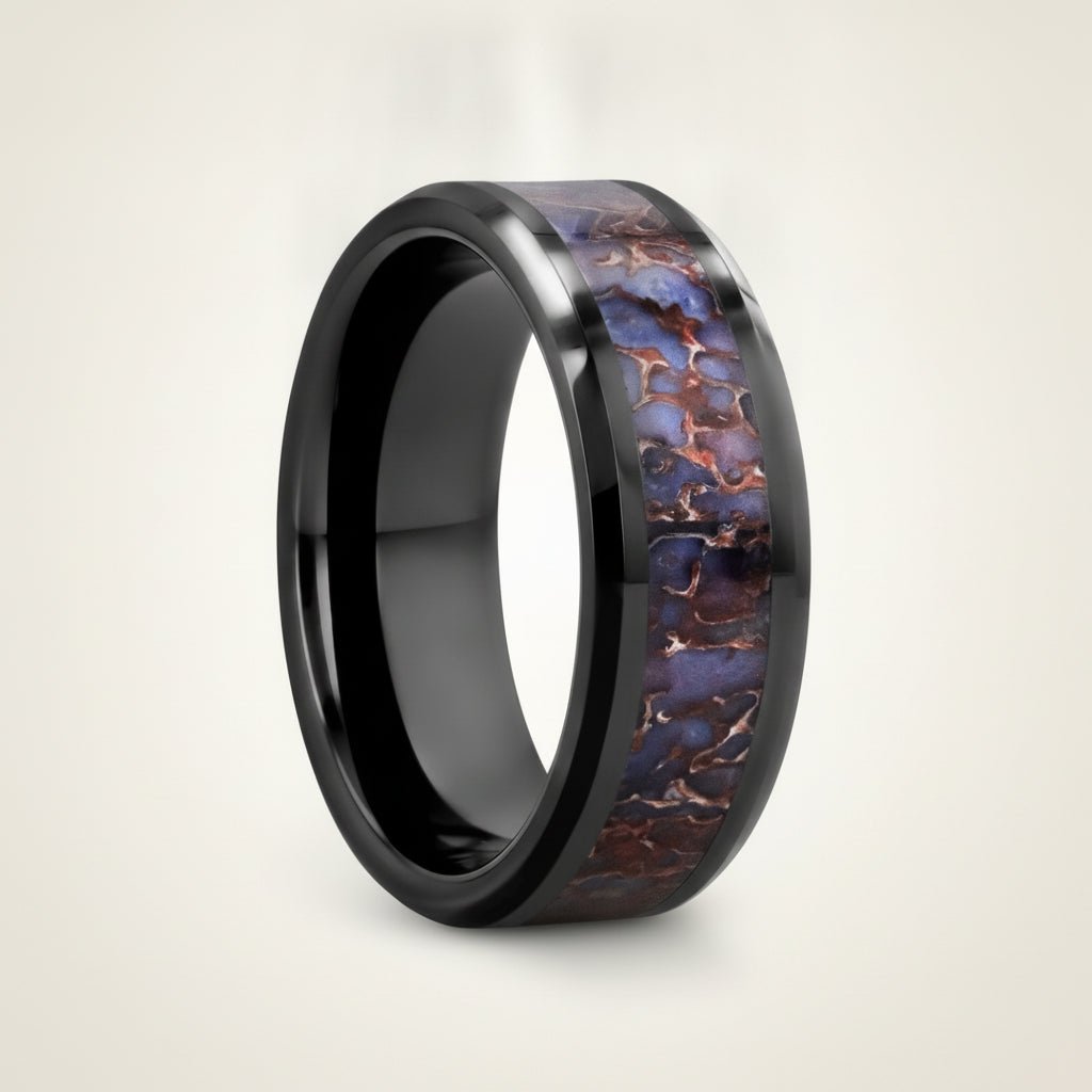 PERMIAN black ceramic ring with blue dinosaur bone inlay running around the band and polished beveled edges, studio hero shot