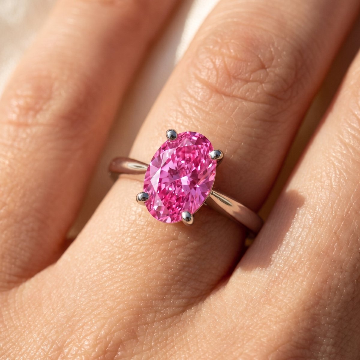 Pink Oval lab-grown diamond solitaire engagement ring, White Gold, on-finger close-up