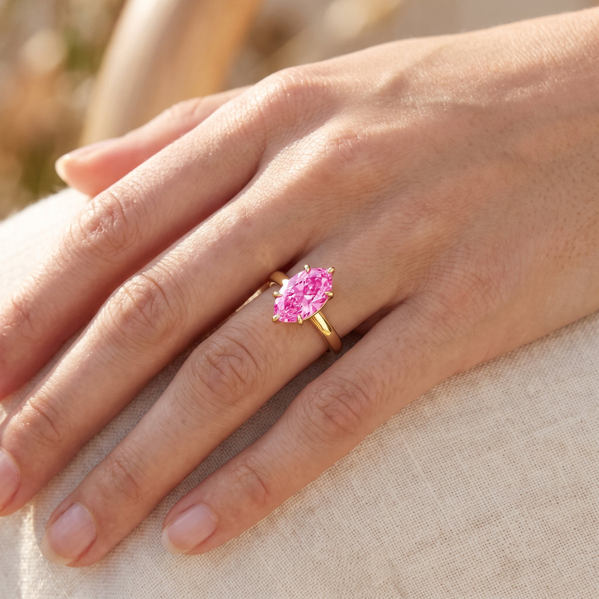 Pink Oval lab-grown diamond solitaire engagement ring, Yellow Gold, lifestyle photograph