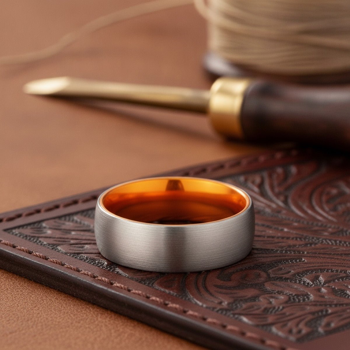 Aydins PORSCHE | Orange Ring, Silver Tungsten Ring, Brushed, Domed lifestyle scene, leather atelier