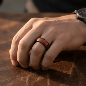 POTLATCH — Lifestyle photo on hand — men's tungsten wedding ring.