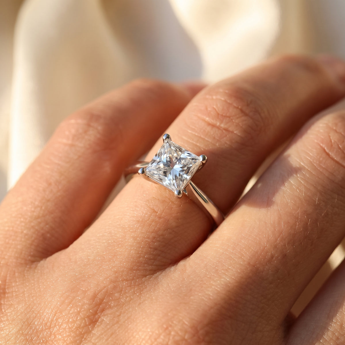 Princess lab-grown diamond solitaire engagement ring, White Gold, on-finger close-up