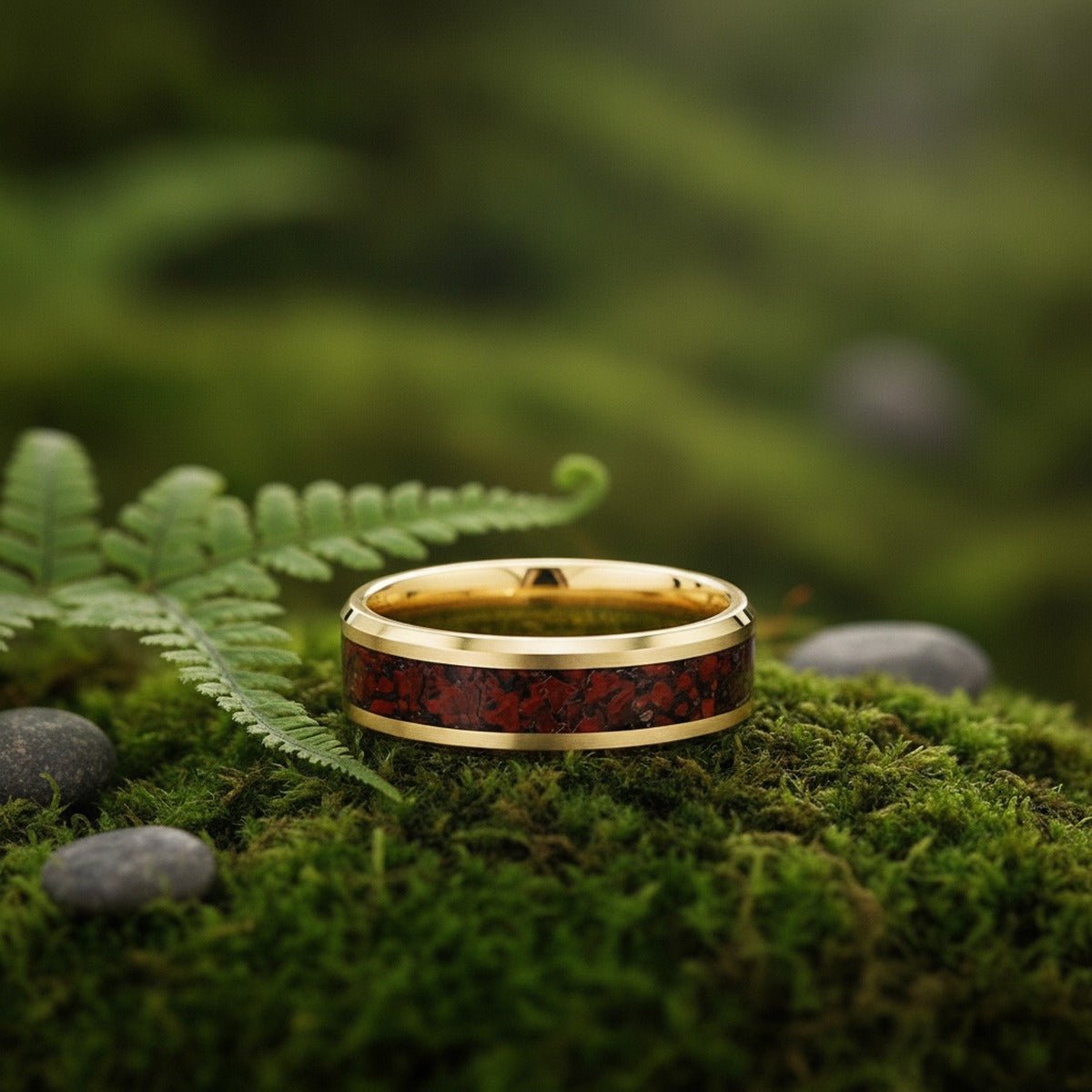 Aydins PYRA | 14k Yellow Gold Ring Red Dinosaur Bone Inlay lifestyle scene, moss forest