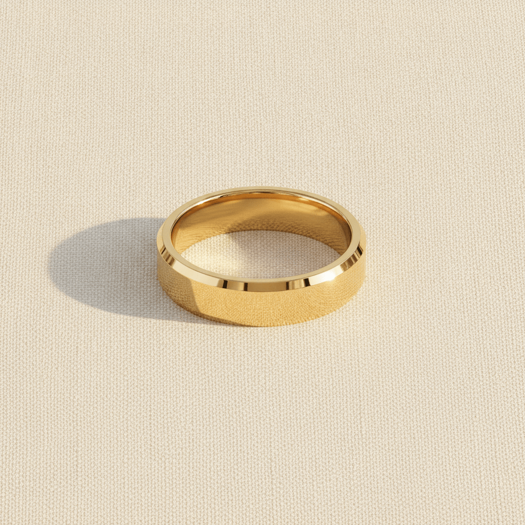 RHODES beveled polished gold-plated tungsten carbide wedding band macro detail overhead flat lay