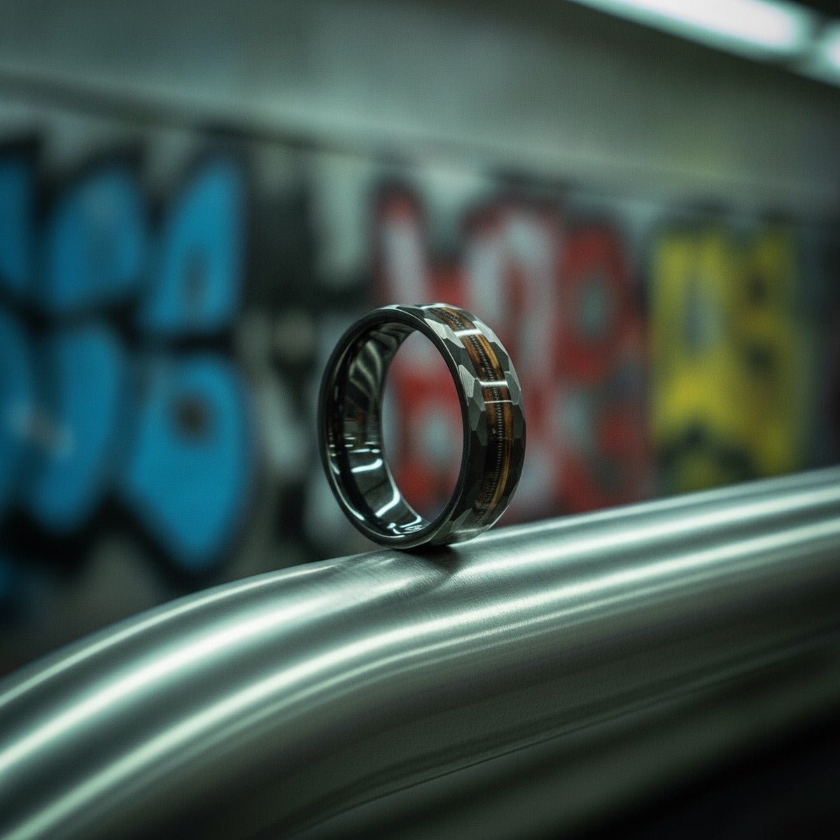 Aydins RIFF | Tungsten Ring, Whiskey Barrel, Guitar String Inlay, Hammered Flat Edges lifestyle scene, underground train