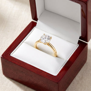 Round lab-grown diamond solitaire engagement ring, in Yellow Gold, shown inside an open cherry-wood ring box