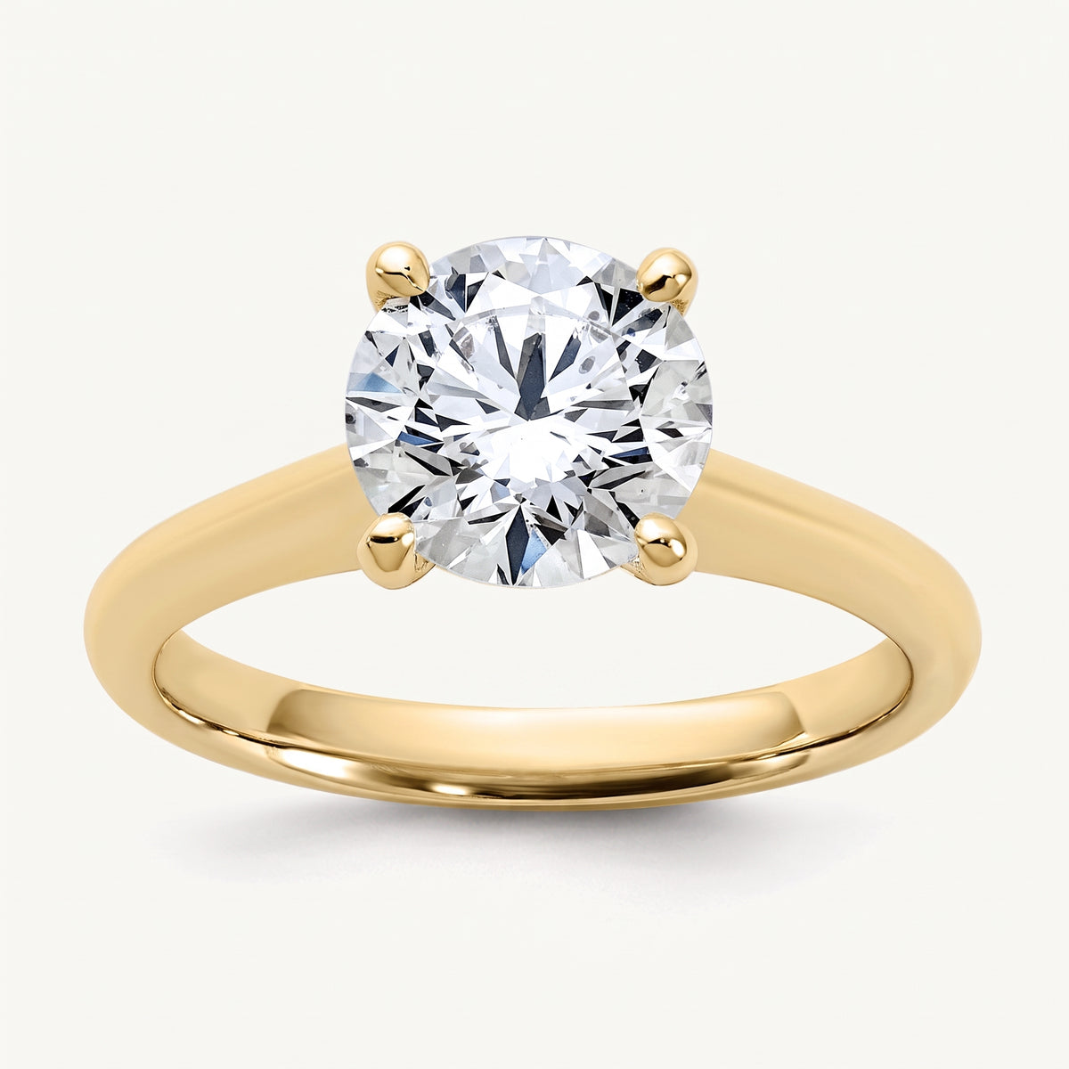 Round lab-grown diamond solitaire engagement ring, in Yellow Gold, studio hero