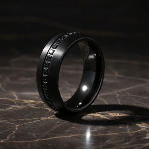 SANCHO — Luxury 3/4 angle on dark marble — men's tungsten wedding ring.
