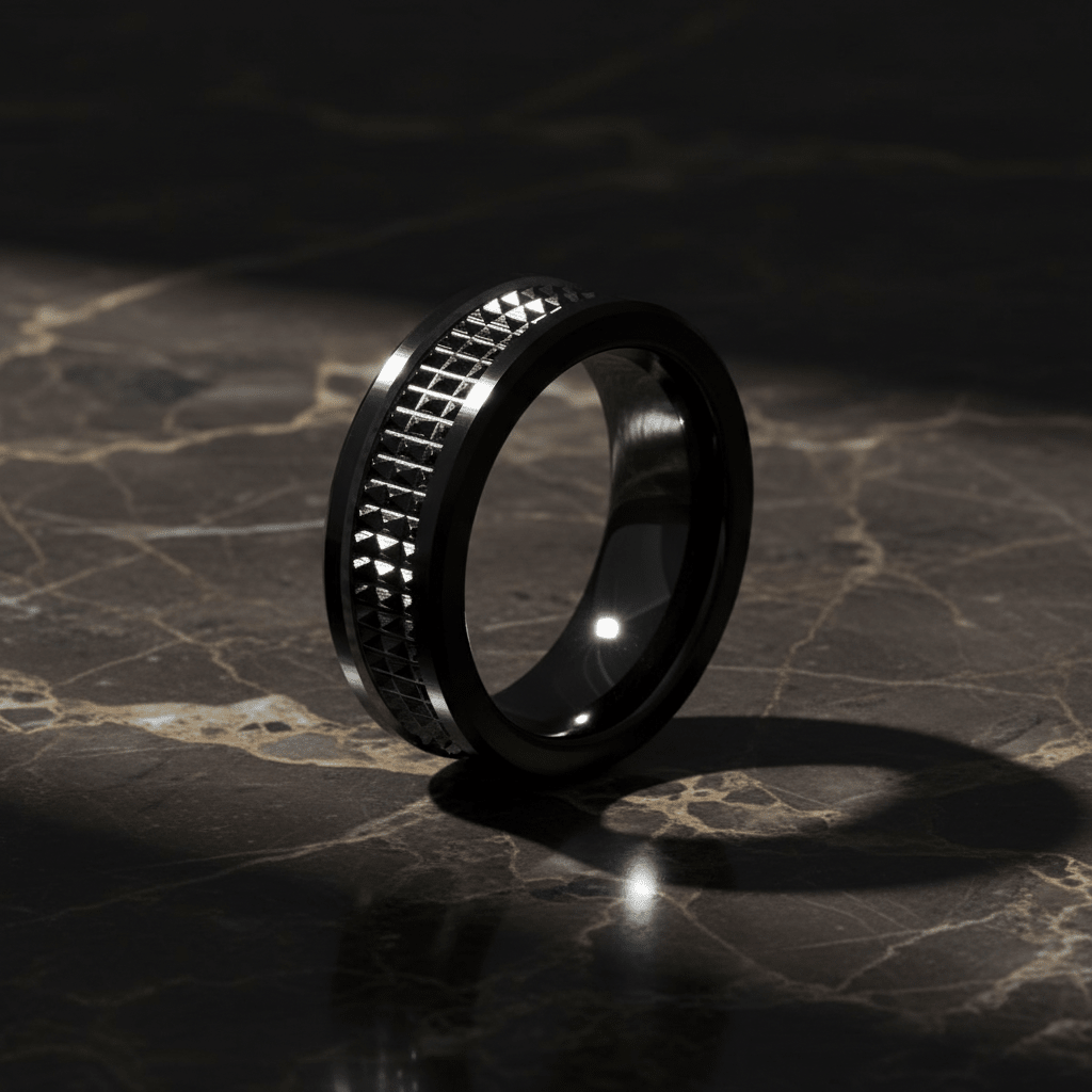 SILVERFANGNOIR — Luxury 3/4 angle on dark marble — men's tungsten wedding ring.