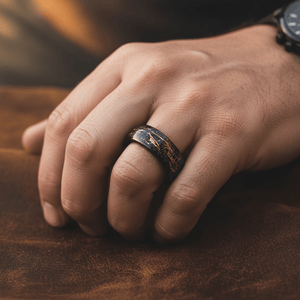 SLICK — Lifestyle photo on hand — men's tungsten wedding ring.