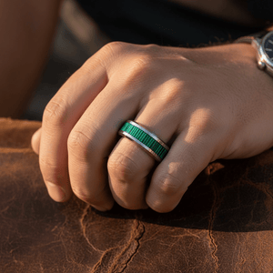 SUITLAND — Lifestyle photo on hand — men's tungsten wedding ring.