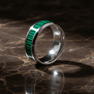 SUITLAND — Luxury 3/4 angle on dark marble — men's tungsten wedding ring.