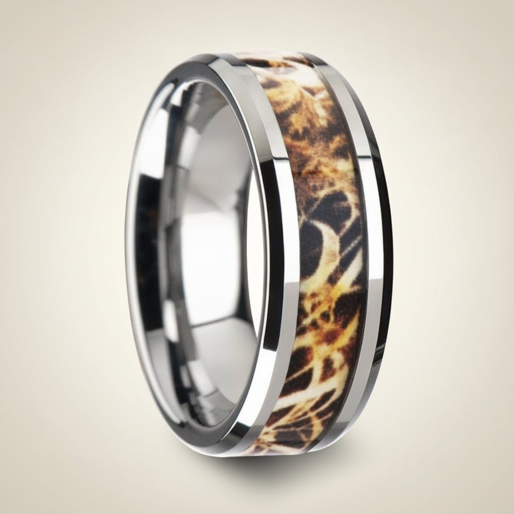 TERRA silver tungsten carbide wedding band with leaves and grassland woodland camouflage inlay running around the band and polished edges, studio hero shot
