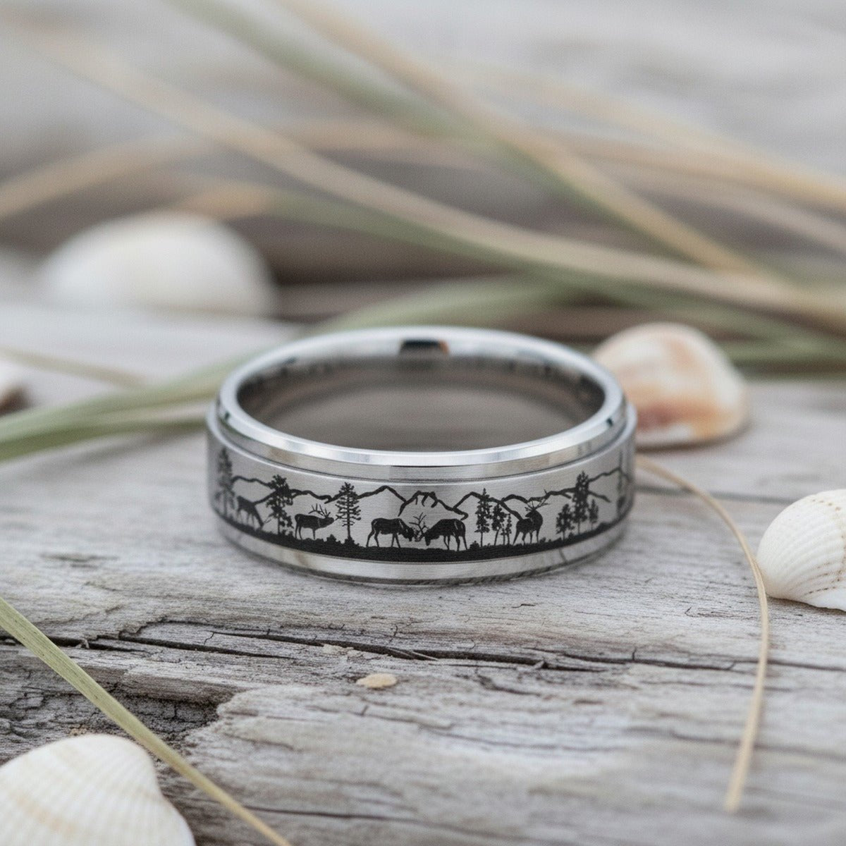 Aydins TIMBER | Laser Engraved Deer Stag Mountain Range Scene Tungsten Spinner Ring for Men with Bevels - 8MM lifestyle scene, driftwood shells