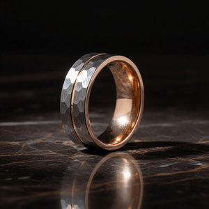 TROOPER — Luxury 3/4 angle on dark marble — men's tungsten wedding ring.