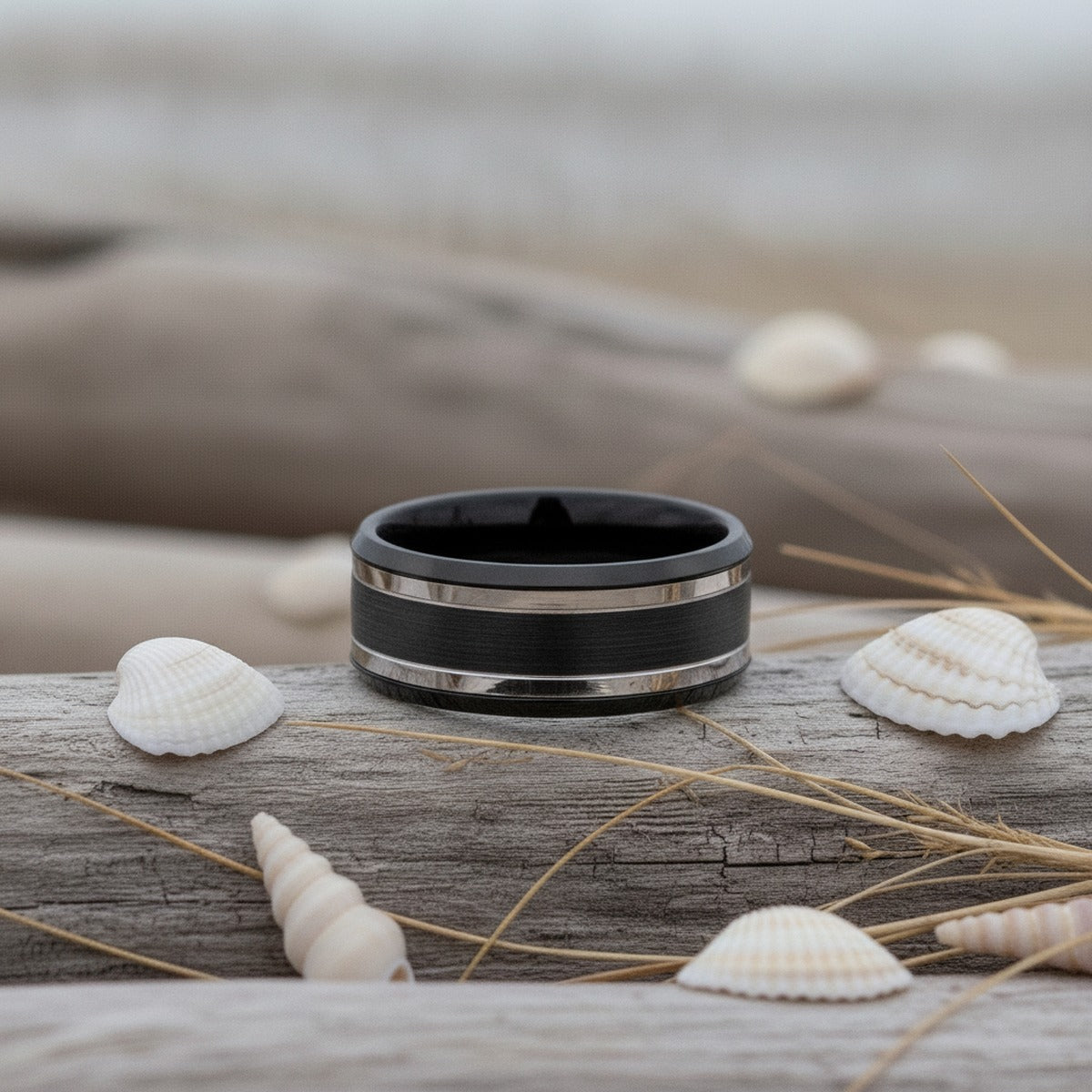 Aydins VELUTUS | Black Tungsten Two Silver Groove Wedding Ring 8mm lifestyle scene, driftwood shells