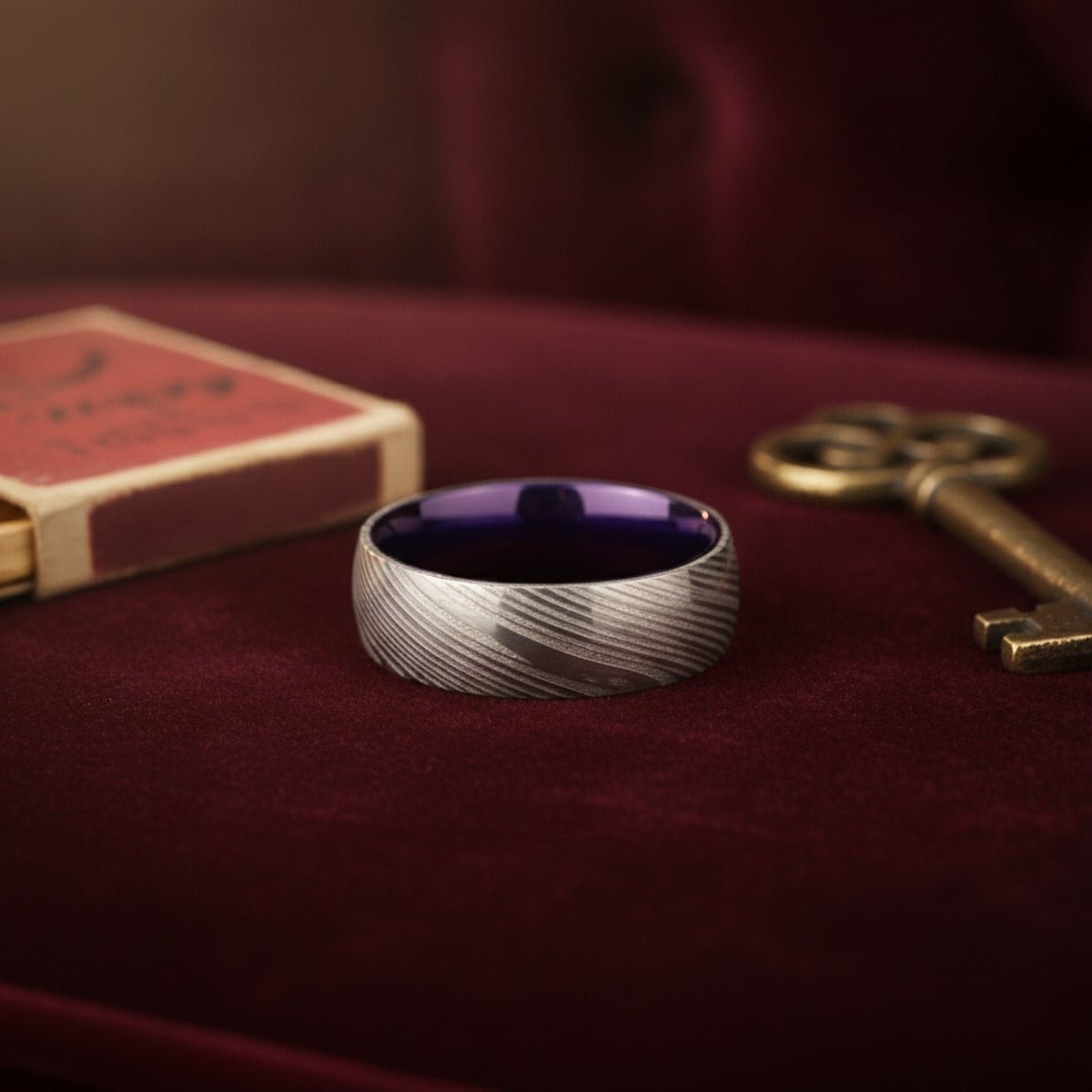 Aydins VERBENA | Purple Ring, Silver Damascus Steel, Domed lifestyle scene, speakeasy velvet