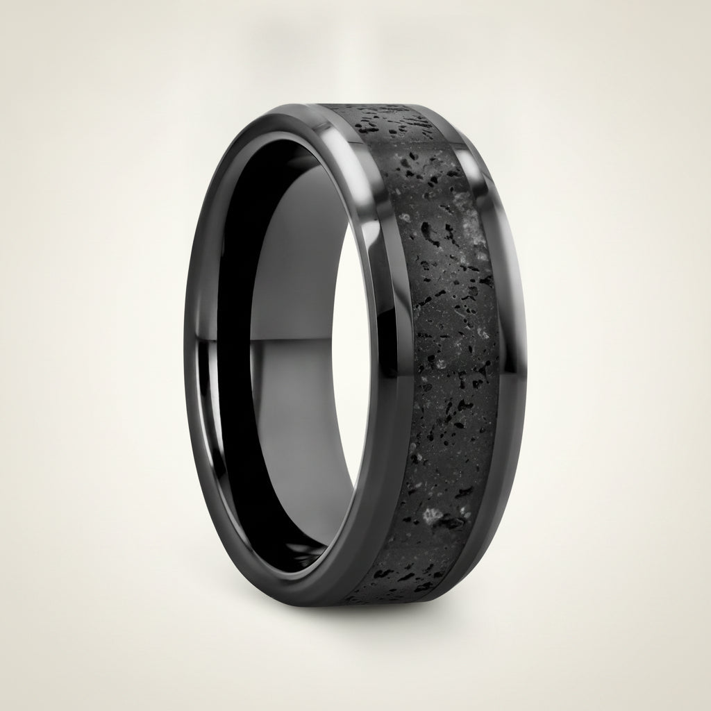 VESUVIUS polished black ceramic wedding band with black and gray lava rock stone inlay running around the band and polished beveled edges, studio hero shot