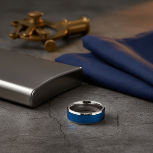 WAYLON — Editorial masculine still life — men's tungsten wedding ring.