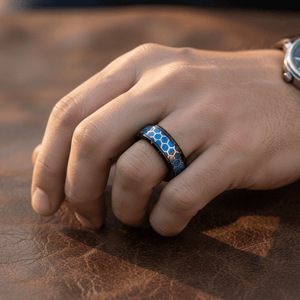 YANKTON — Lifestyle photo on hand — men's tungsten wedding ring.