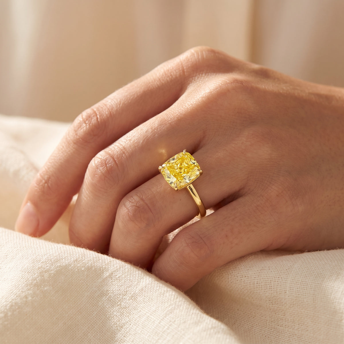 Yellow Cushion lab-grown diamond solitaire engagement ring, Yellow Gold, lifestyle photograph