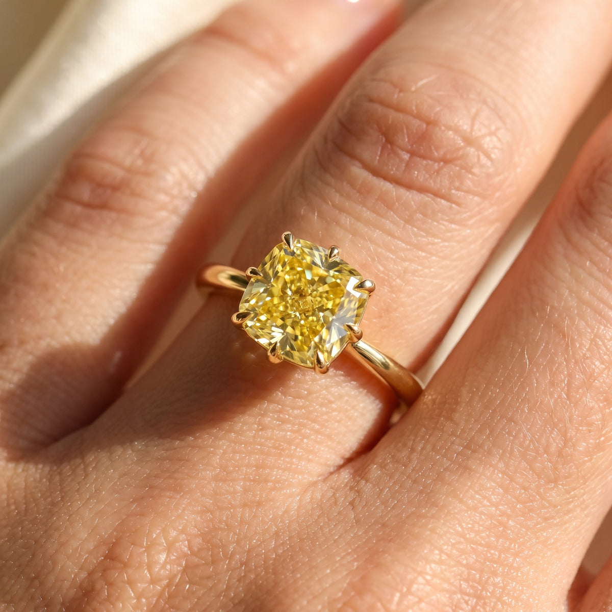 Yellow Cushion lab-grown diamond solitaire engagement ring, Yellow Gold, on-finger close-up