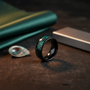 ZURLOU — Editorial masculine still life — men's tungsten wedding ring.