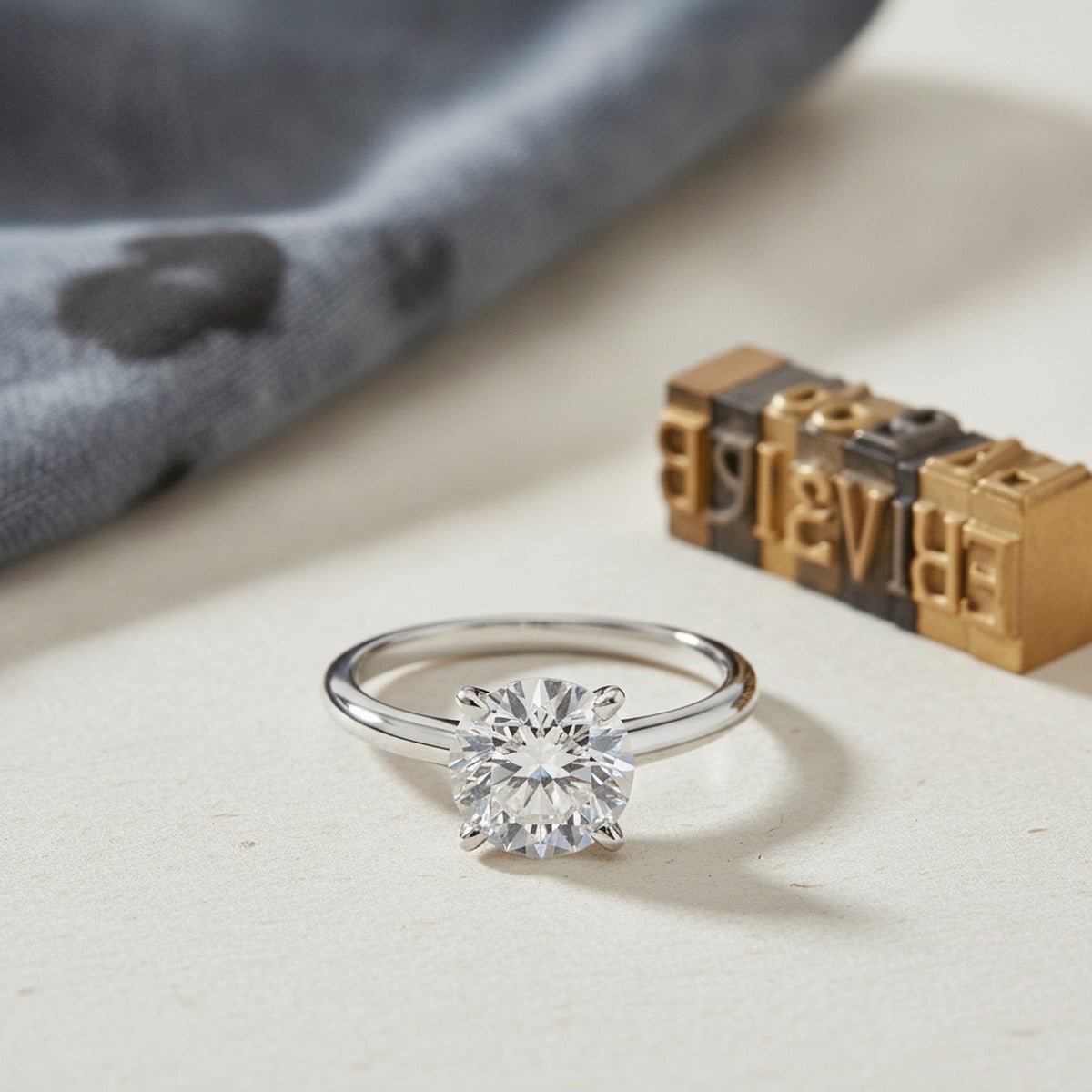 Aydins 1 Carat Round Lab Grown Diamond Engagement Ring | 10K White Gold lifestyle scene, letterpress print