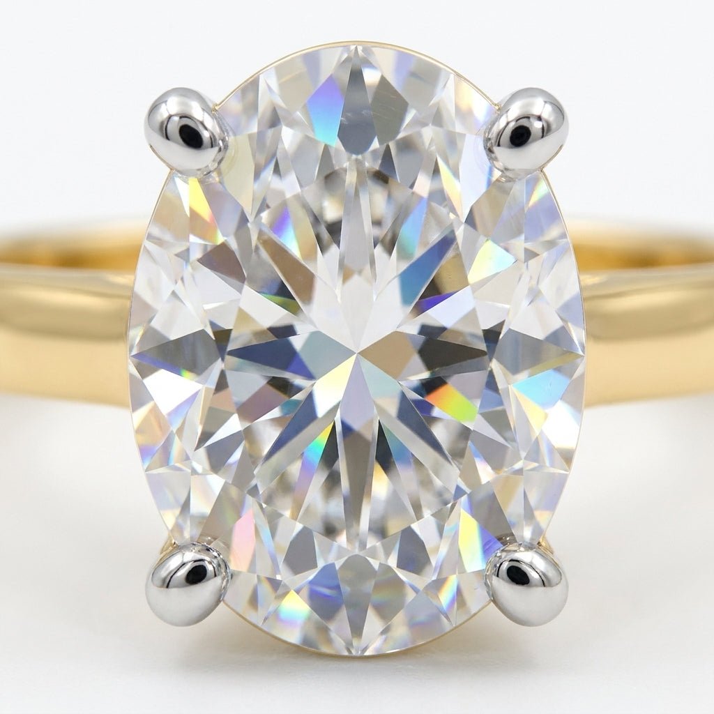 Macro close-up of 2 carat oval lab grown diamond showing brilliant facets and sparkle