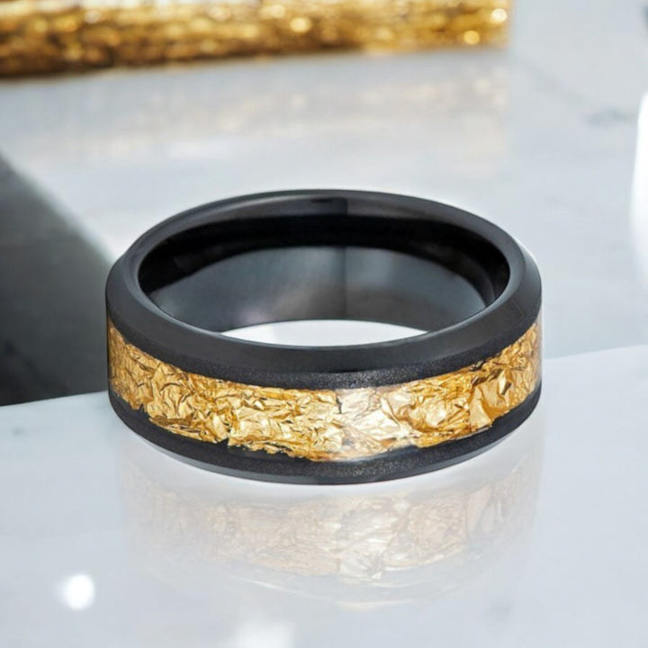 8mm black tungsten ring with polished beveled edges and gold foil detail.