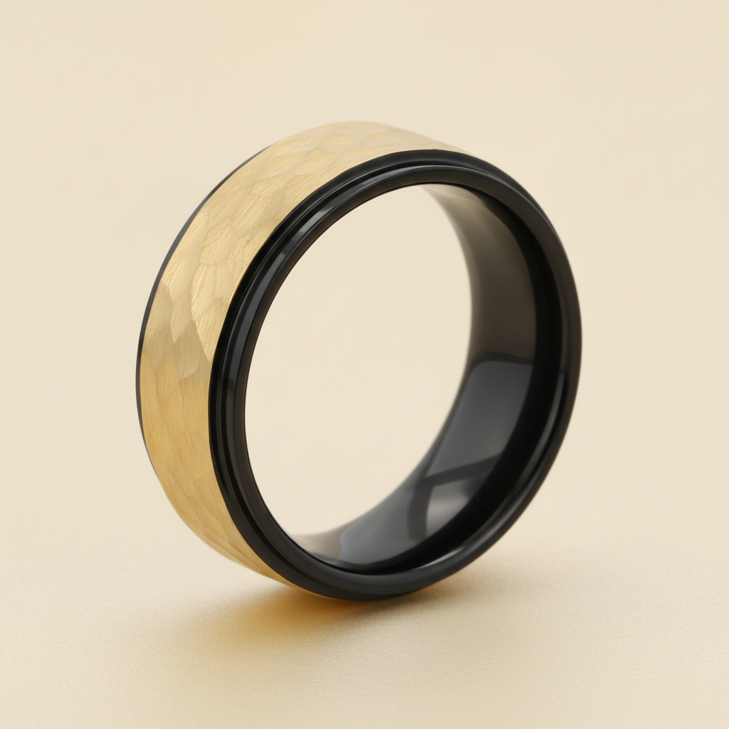 CREED black tungsten wedding band with raised hammered gold-plated finish, studio hero shot