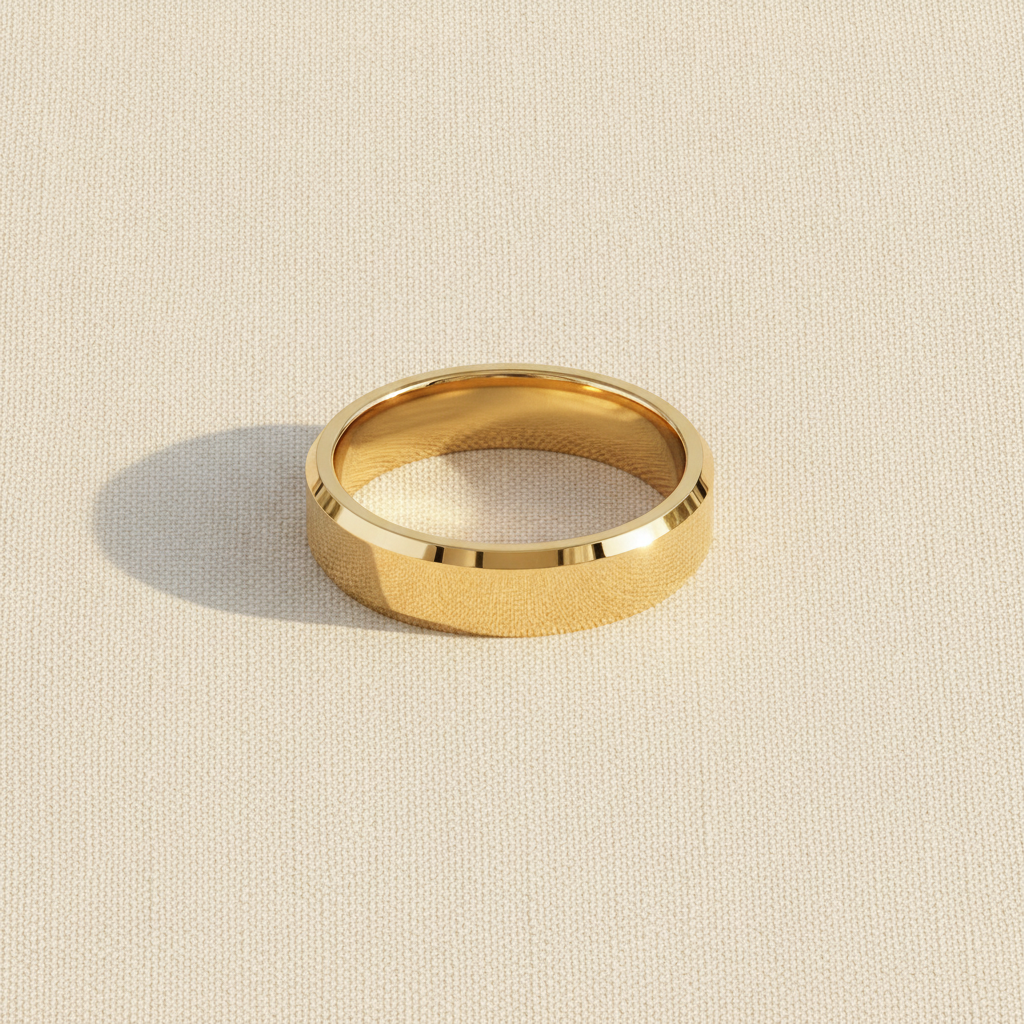 RHODES beveled polished gold-plated tungsten carbide wedding band macro detail overhead flat lay