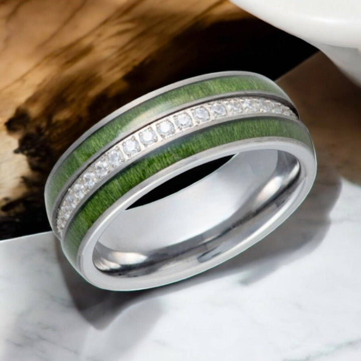 Close-up of ZENTARA ring showcasing jade wood and diamond-simulated CZ stones.