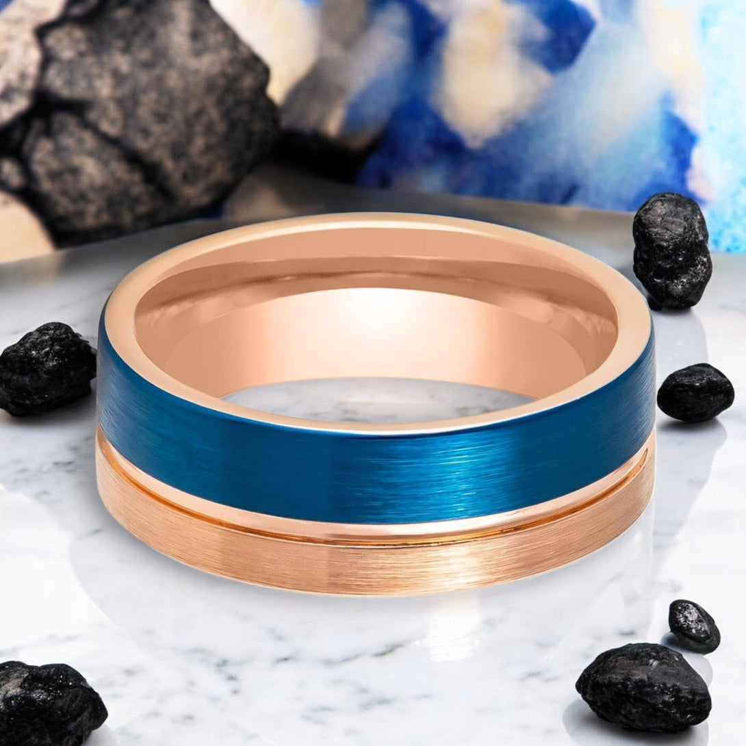 Close-up of ALNAIR Rose Gold Tungsten Ring with Blue Brushed and Grooved Detail