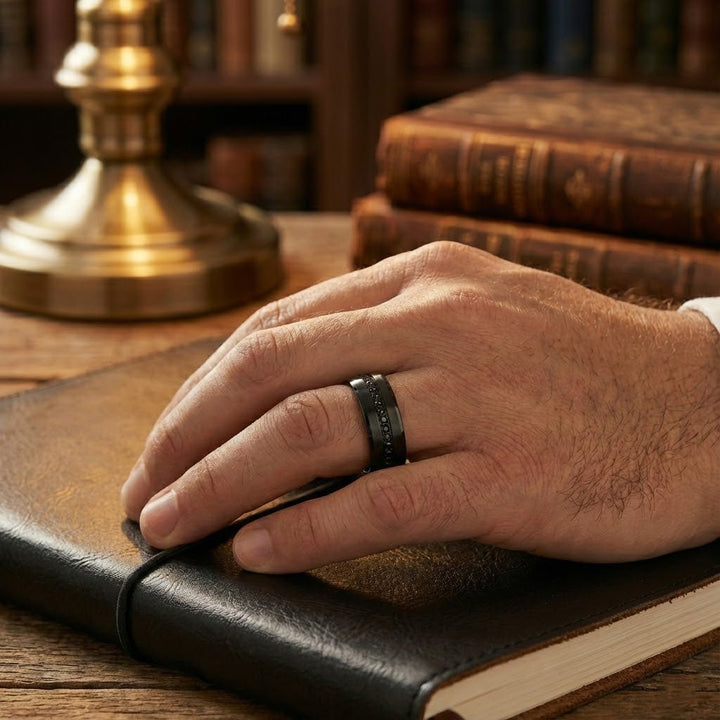 Mans ring finger with a Matte Black APODIS Tungsten Ring - Flat Eternity Band with Black Diamond Stimulants