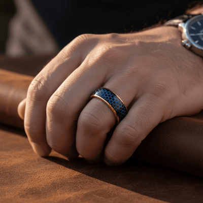 AQUAHEX — Lifestyle photo on hand — men's tungsten wedding ring.