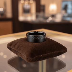 ARAE — Premium boutique display on velvet — men's tungsten wedding ring.