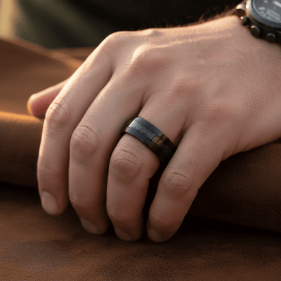 ARAE — Lifestyle photo on hand — men's tungsten wedding ring.