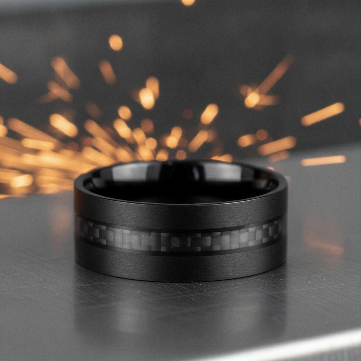 Aydins ARAE | Tungsten Black Carbon Fiber Ring 8mm lifestyle scene, metalworker steel