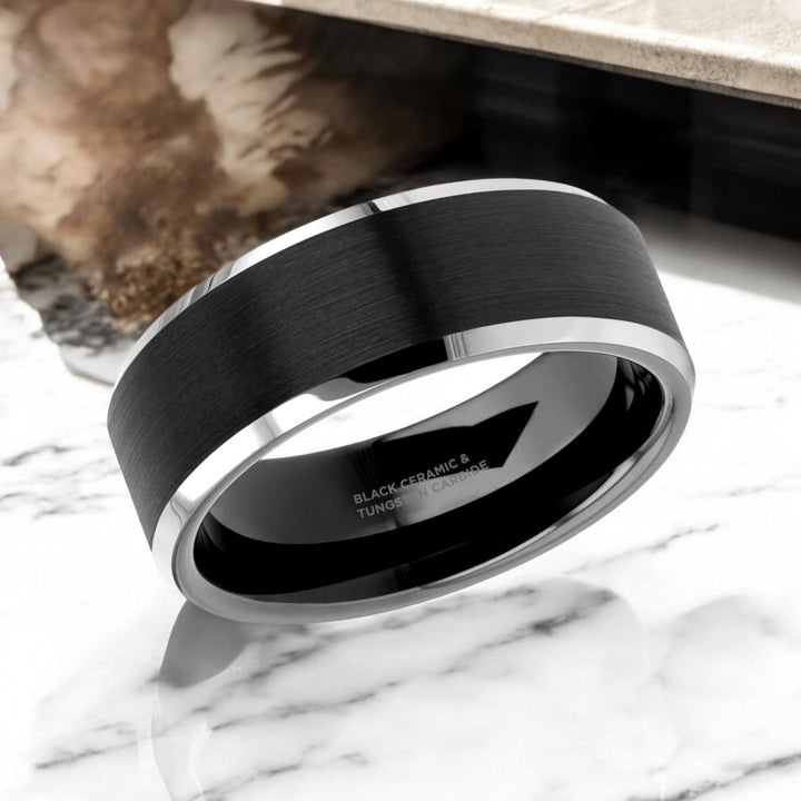 Close-up of brushed black ceramic center and polished tungsten edges on the ARDEN ring.