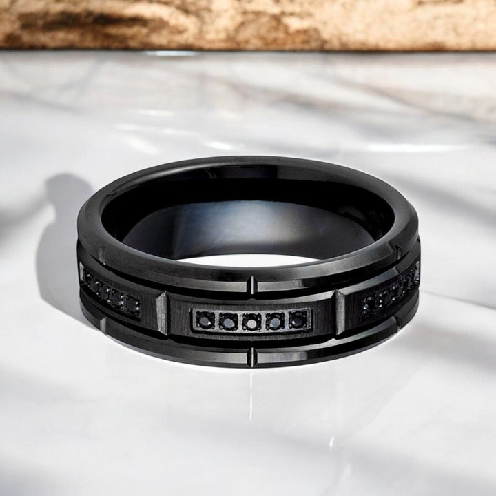 8mm ARKOS black tungsten carbide ring with sectional CZ accents.