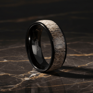 ARNEB — Luxury 3/4 angle on dark marble — men's tungsten wedding ring.