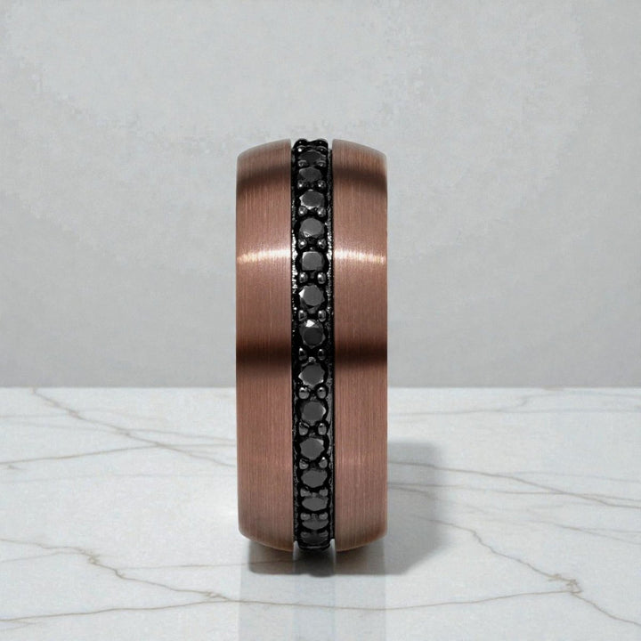 Close-up of black sapphire gemstones on espresso tungsten carbide band